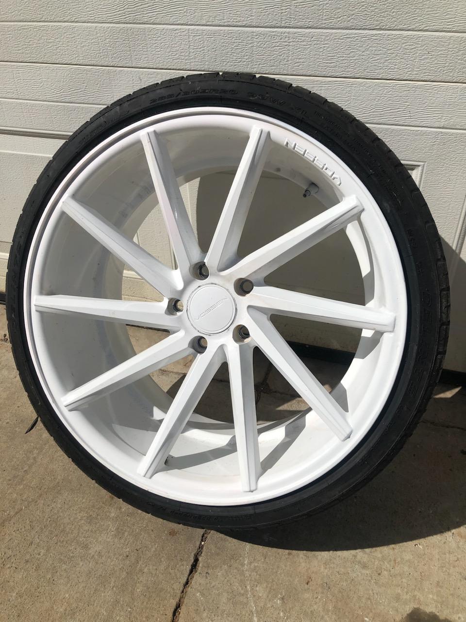 Black wheel with red brake calipers