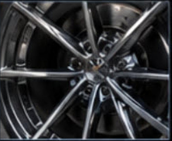 Chrome multi-spoke wheel hub close up detail